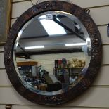 A modern copper-framed circular bevel-edge wall mirror, overall diameter 55cm