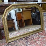 A modern gilt-framed arch-top bevel-edge over mantel mirror