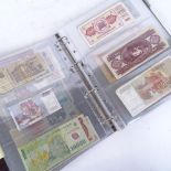 An album of various world banknotes