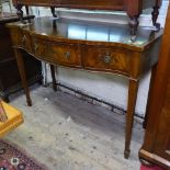 A mahogany serpentine-front and satinwood-strung serving table, 3 frieze drawers, on square