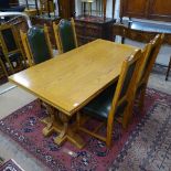 A good quality Jaycee light oak rectangular draw leaf dining table, L167cm extending to 260cm, on