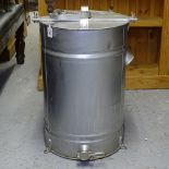 A galvanised metal honey separater