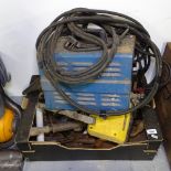 A welder, and a box of miscellaneous hand tools