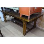 A large rectangular faux marble-top dining table, on architectural square tapered legs and H-