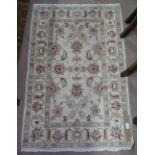 A small cream ground Persian style rug, 125cm x 80cm