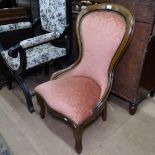 A mahogany-framed nursing chair