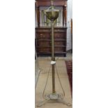 A Victorian brass standard lamp converted to electric
