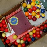 A box of snooker and billiard balls