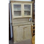 A Continental pine 2-section kitchen dresser, W110cm, H189cm