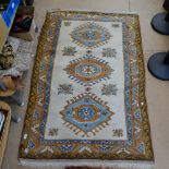 An Turkish design cream ground wool rug, 170cm x 110cm