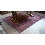 A red ground Afghan carpet, 200cm x 175cm