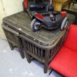 A Heal's weathered teak garden table and chairs, slatted table with 4 conforming tuck-under