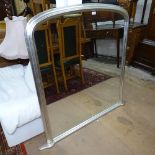 A silvered-frame arch-top over mantel mirror, W125cm, H120cm