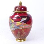 Carlton Ware Rouge Royale jar and cover with painted and gilded bird design, Wedgwood Jasperware