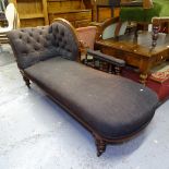 A 19th century carved mahogany-framed chaise longue, with buttoned-back upholstery, on turned