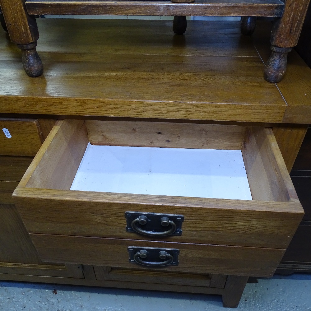 A modern solid oak dresser base, with fitted short drawers and panelled cupboards, on stile legs, - Image 2 of 2