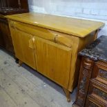 Andrew J Milne for Heal's - a mid-century blonde wood sideboard, circa 1952, with single frieze