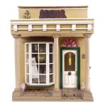 A handmade Victorian Townhouse design doll?s house, containing various accessories, furniture,