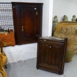 A Georgian oak hanging corner cupboard, with single panel door, and a 1920s oak hanging corner