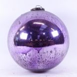 A purple lustre witch's ball, diameter 25cm