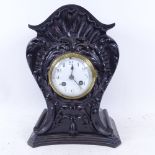 A 2-train mantel clock in carved ebonised case