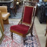 A 19th century rosewood nursing chair