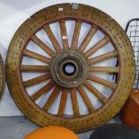 A large Antique heavy wooden gun carriage wheel with steel rim and studwork decoration, H205cm