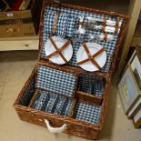 A wicker picnic hamper complete with contents