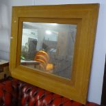 A modern oak-framed wall mirror, 110cm x 90cm