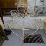 A 19th century painted wrought-iron demilune 3-tier plant stand, H110cm