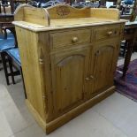 A polished pine cabinet with raised gallery, drawers and cupboards under, W91cm, H90cm