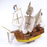 A handmade model ship on stand of a 17th century galleon, length 85cm, height 66cm