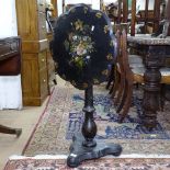 A Victorian lacquered tilt-top occasional table, with floral painted and gilded decoration, W50cm