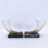 A pair of gilt-metal hand terminal clear glass cornucopia, on green veined marble bases, height 12cm