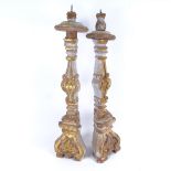 An Antique pair of carved painted and gilded wood pricket candle stands, height 69cm