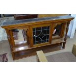A Victorian oak over mantel, with lead glazed panelled door and turned pilisters, L148cm, H88cm