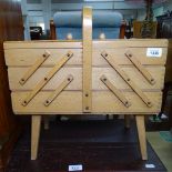 A small pine and beech cantilever sewing cabinet