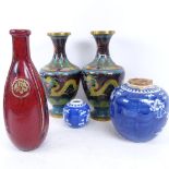 A pair of Chinese cloisonne enamel vases, blue and white prunus pattern ginger jar, and a red glazed