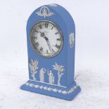 A Wedgwood blue Jasperware lancet-top mantel clock, movement by Baronet of London, case height 19.