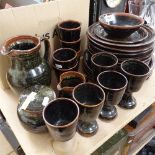 A group of Winchcombe Pottery, including dinner plates, jug, beakers and goblets