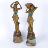 A pair of art deco gilded spelter figures, on green onyx bases Height 29cm
