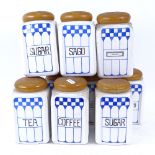 A set of 9 German Art Deco ceramic kitchen storage jars, 7 are marked Felix, with turned wood