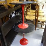 A pair of Eero Saarinen design tulip tables, with black and grey veined marble tops, on painted