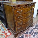 A reproduction cross-banded mahogany bachelor's chest of serpentine form, with brushing slide and