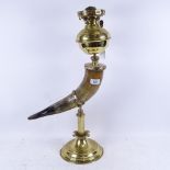 A brass and buffalo horn oil lamp, with opaque glass shade, height to top of shade 75cm