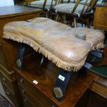 A Middle Eastern camel seat with leather cushion