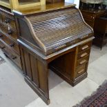 A small 1930s roll-top single-pedestal writing desk, W90cm, H118cm