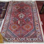 A red ground Afghan design carpet, 245cm x 165cm