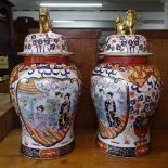 A pair of large Chinese design ceramic baluster vases and lids, with enamel and gilded decoration,