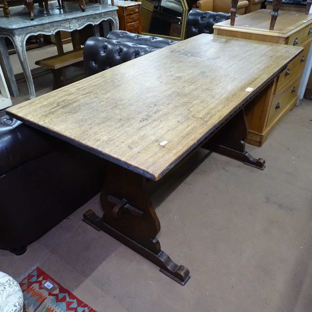 A 1930s oak rectangular refectory dining table, on pegged tablet ends, L153cm, H76cm